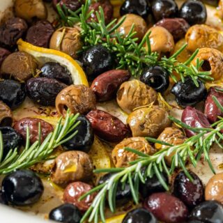 Oven baked olives in baking dish