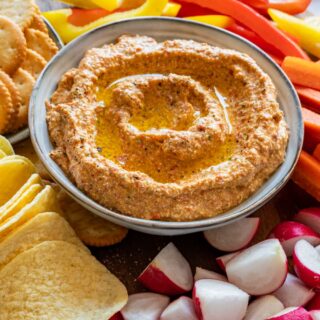 Creamy cottage cheese dip with vegetables and crisps.