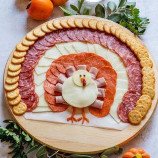 Turkey shaped charcuterie board for Thanksgiving.