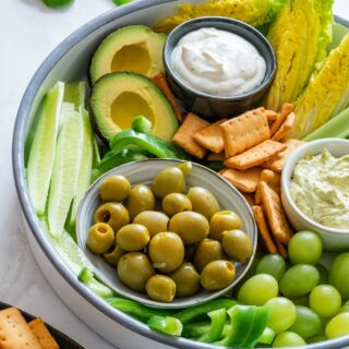 Green snack board with dip for St. Patrick’s Day.