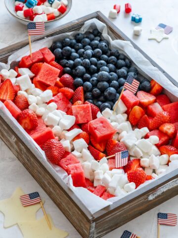 Fourth of July fruit platter with red, white and blue colors.
