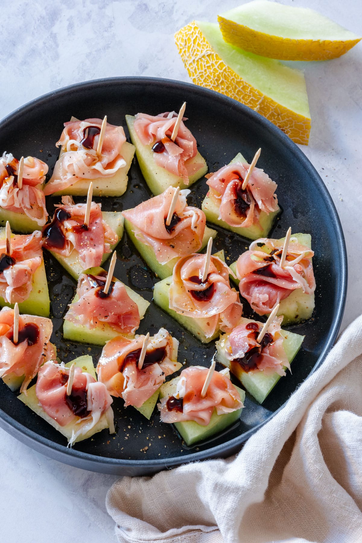 Sweet, salty and refreshing melon and prosciutto appetizers.