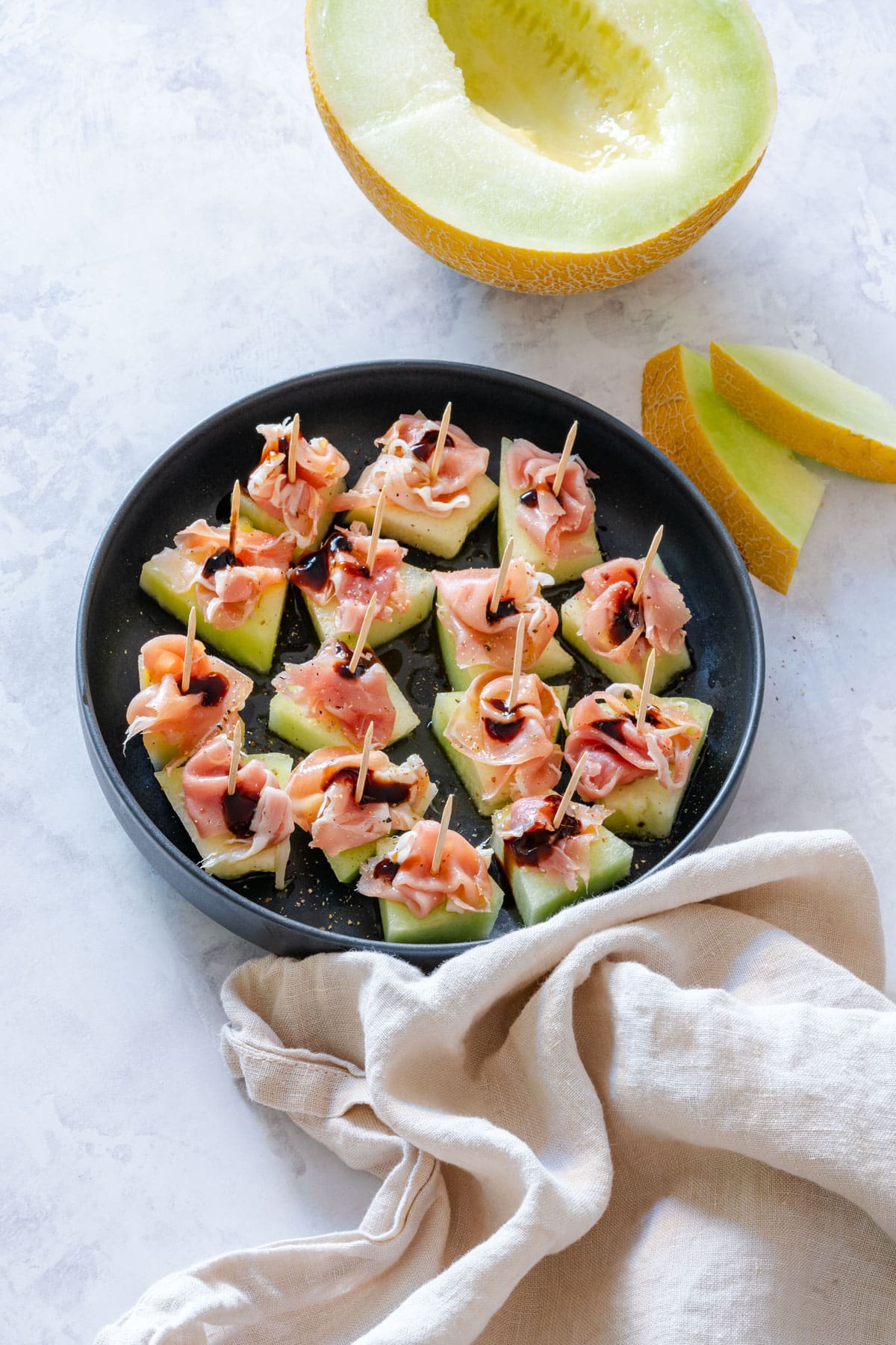 Prosciutto and melon bites for any gathering.