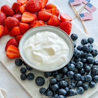 Yogurt fruit dip with strawberries and blueberries.