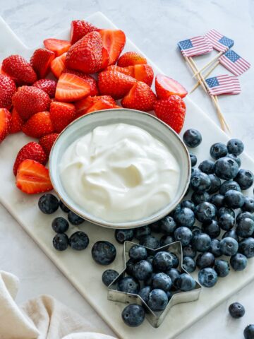 Yogurt fruit dip with strawberries and blueberries.