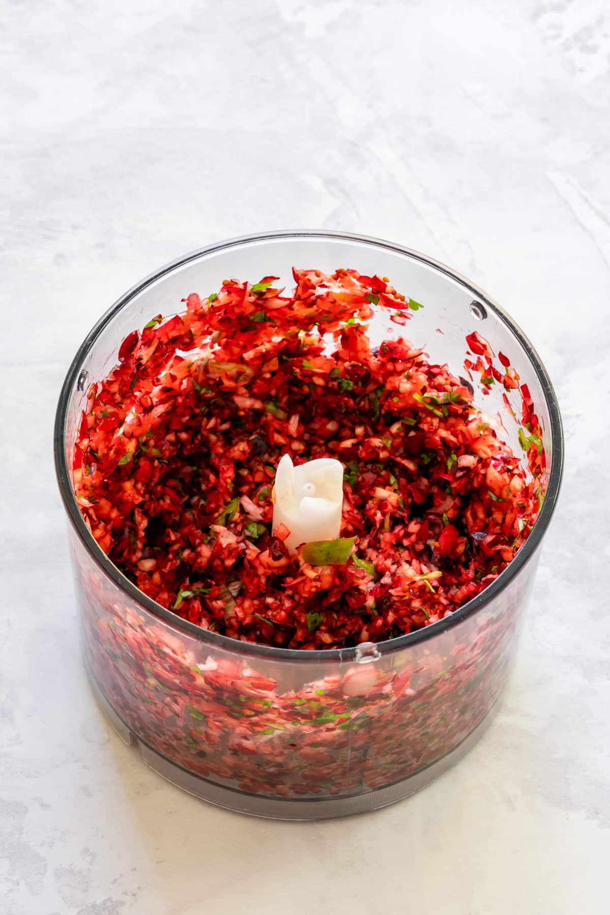 Finely chopped cranberry mixture in a food processor.